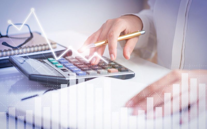 accountant-calculating-profit-with-financial-analysis-graphs accountant-calculating-profit-with-financial-analysis-graphs