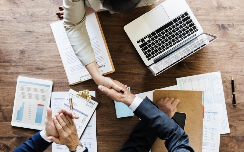 business-people-shaking-hands-together