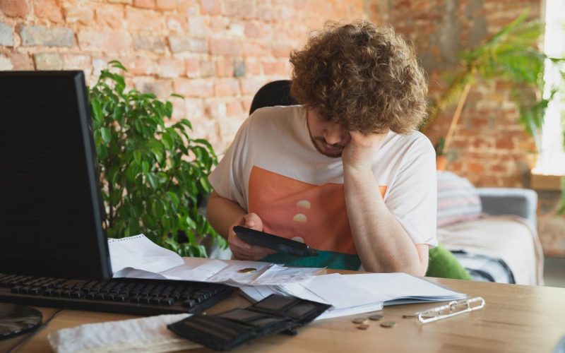 caucasian-upset-despair-man-doing-financial-economical-reports