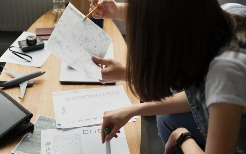 close-up-people-planning-trip-with-map close-up-people-planning-trip-with-map