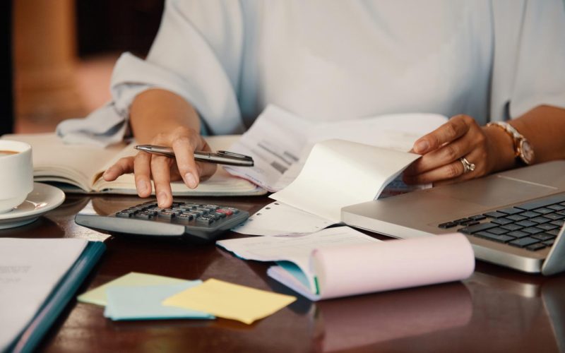 entrepreneur-working-with-bills entrepreneur-working-with-bills