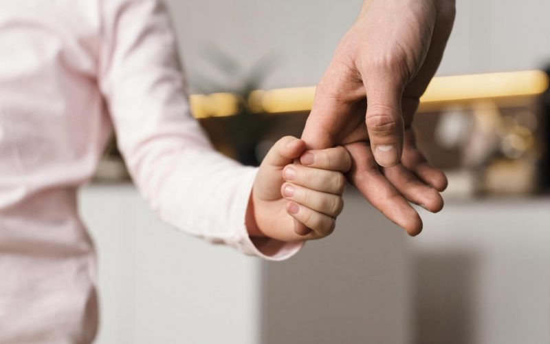 little-girl-holding-hands-with-father little-girl-holding-hands-with-father