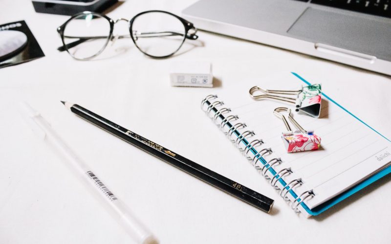 stationery-near-glasses-laptop